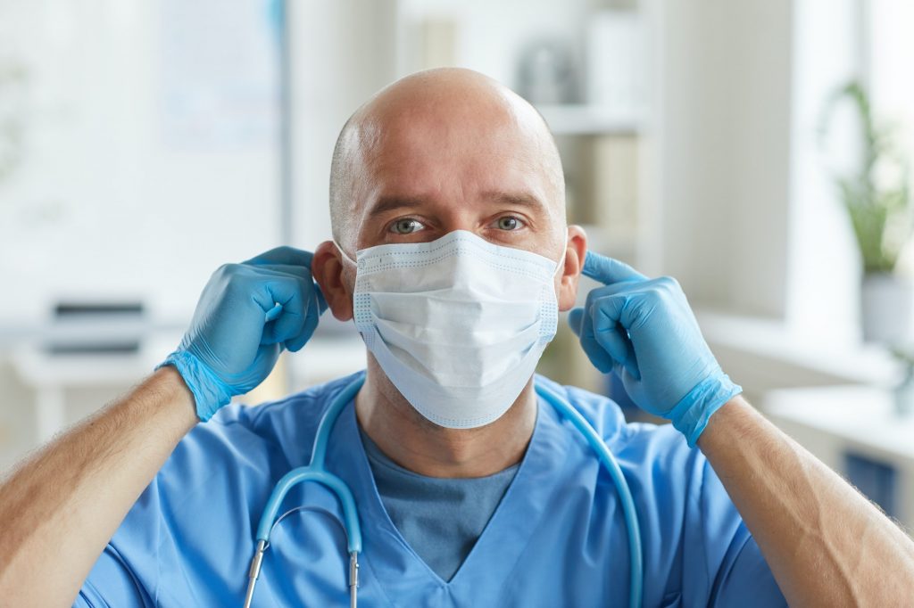Doctor Putting On Mask