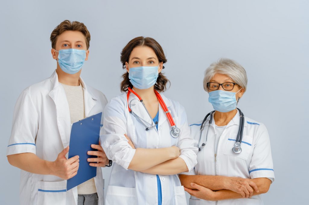 Team of doctors wearing facemasks
